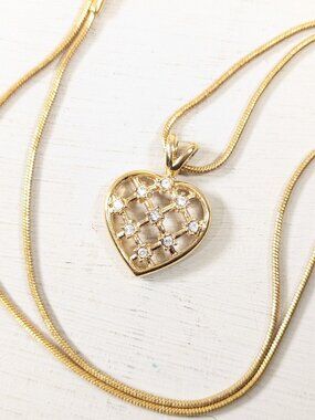 Gold tone rhinestone heart pendant on snake chain